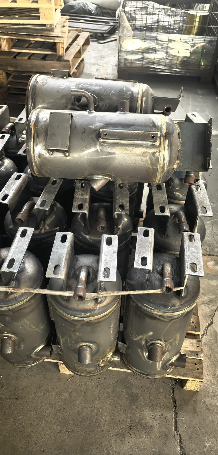 Air compressor oil separator tanks in a workshop