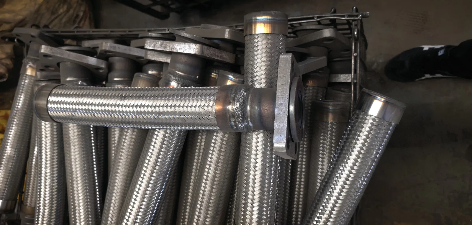 Stainless steel braided compressor hose assemblies in workshop